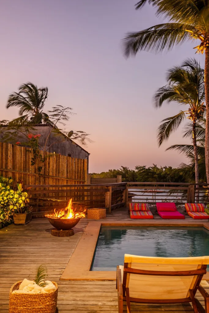 Fire pit on the deck at dusk, Guriú, Ceará